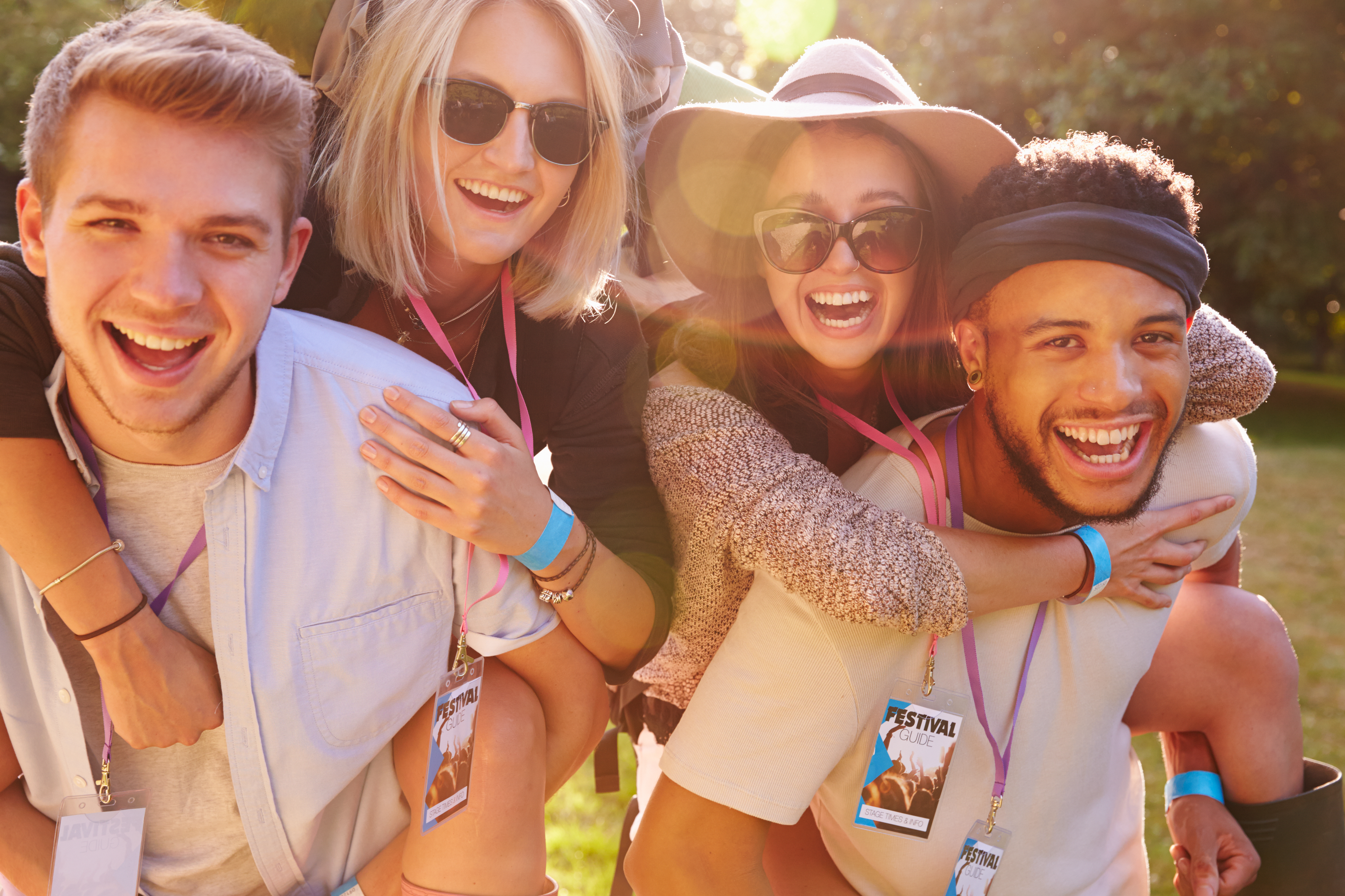 Men,Giving,Woman,Piggybacks,On,Their,Way,To,Music,Festival